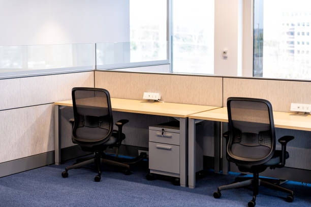 istock Empty office room with chairs wooden table and power outlet architecture and nobody by cubicle corporate desk 1138219079