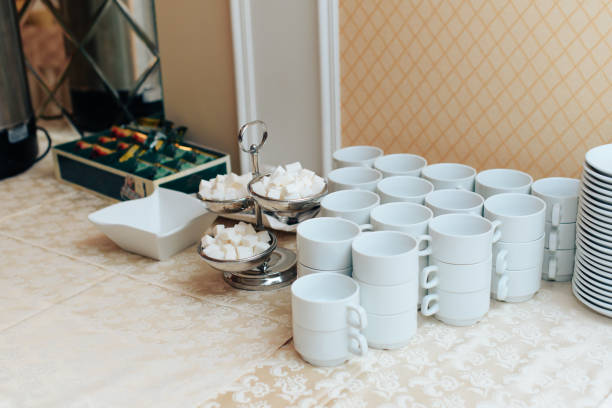 istock set of white cups on a white tablecloth 1 1138220237