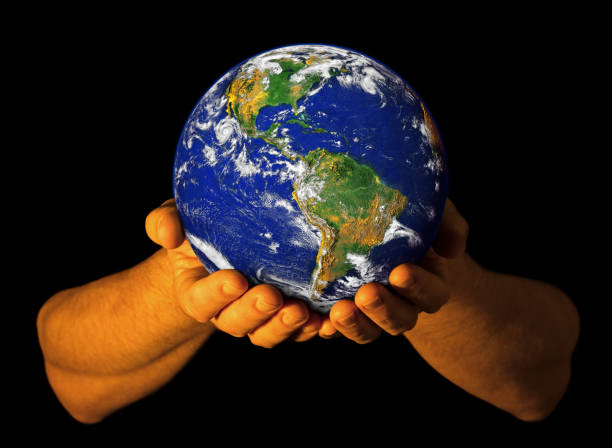istock Hands holding the Earth with North America visible 1138221090