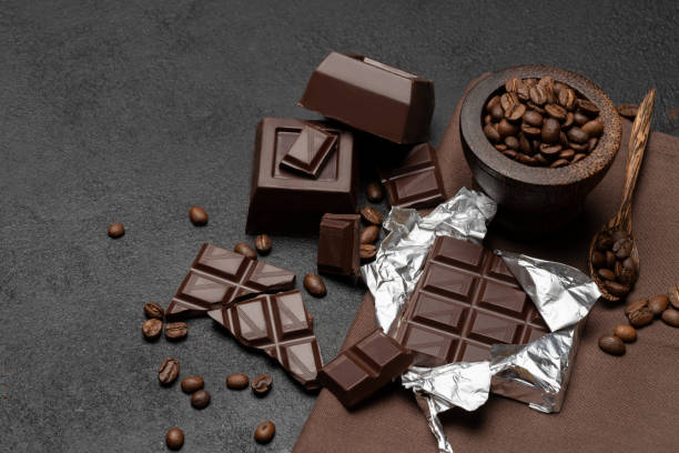 istock dark organic chocolate and coffee beans on concrete background 1138221463
