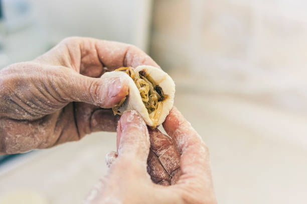 istock Female hands kneading making dough for dumplings 1138221691
