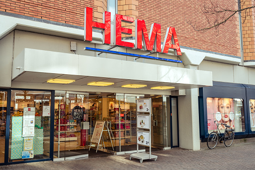 Dordrecht, The Netherlands - March 03, 2019: Close up of the HEMA logo on a storefront wall. The HEMA chain is characterized by relatively low pricing of generic housewares often with original design.