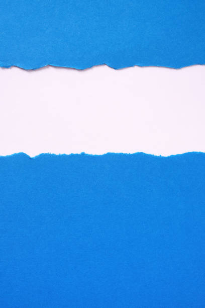 istock Torn blue paper strip untidy edge border frame vertical 1138226791
