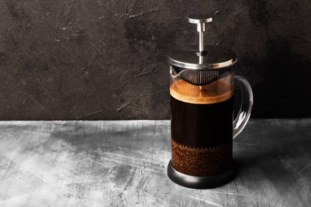 coffee in french press on dark background. copy space. food background - pouring coffee liquid coffee bean imagens e fotografias de stock