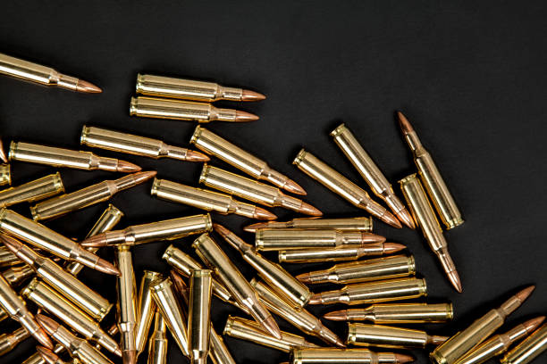 rifle cartridges on a black background - full metal jacket imagens e fotografias de stock