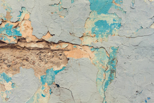 istock Texture of cracked blue and yellow wall background. 1138228045