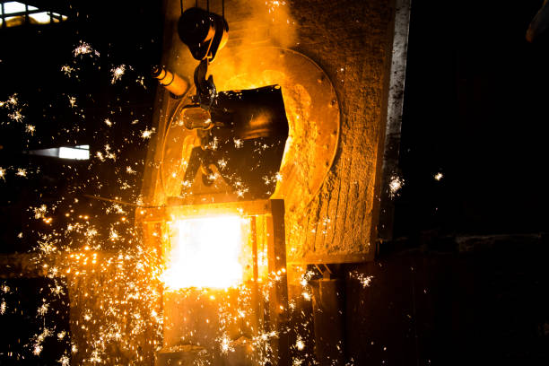 istock metal casting process with red high temperature fire in metal part factory 1138228219