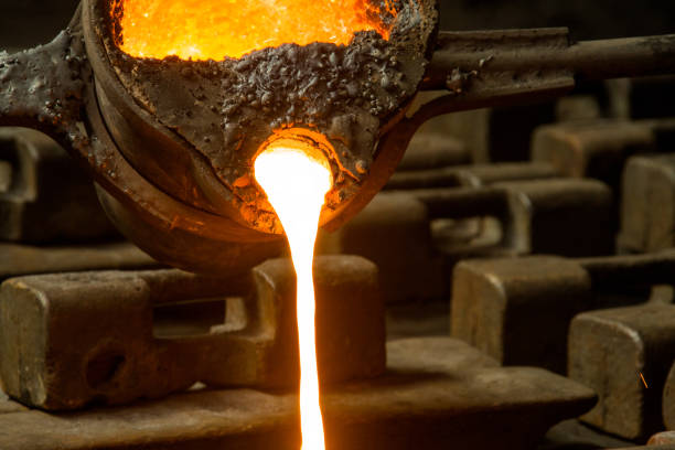 istock metal casting process with red high temperature fire in metal part factory 1138228221