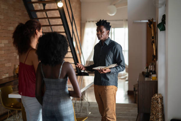 Real estate agent showing a property to consumers