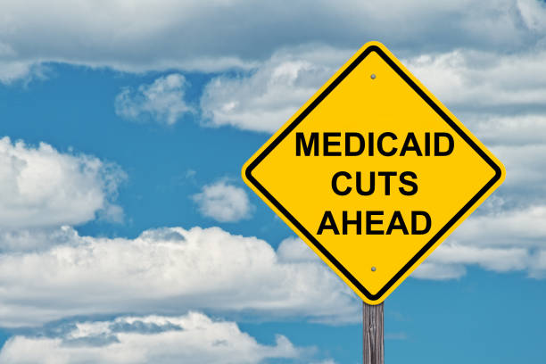 istock Medicaid Cuts Ahead Caution Sign With Blue Sky Background 1138232485