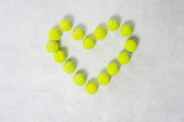 istock Tennis Balls in Heart Shape Love 1138233061