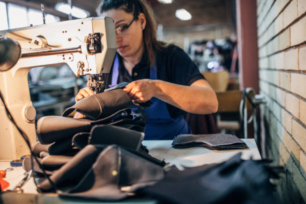 istock Woman sewing shoes 1138234365