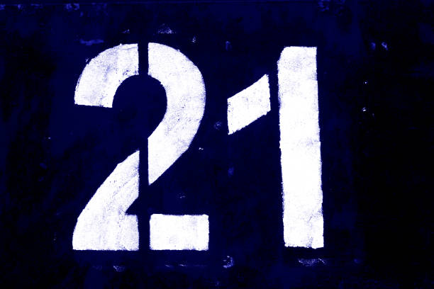 istock Number 21 in stencil on metal wall in blue tone. 1138236522