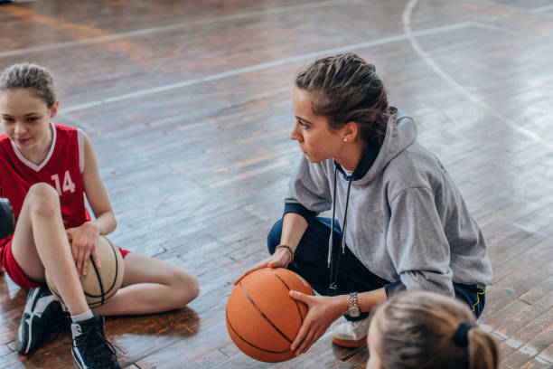 istock Coach with basketball team 1138240762