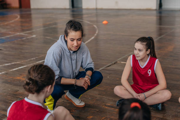 istock Coach with basketball team 1138242316