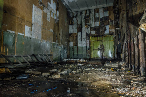 istock Inside abandoned machine hangar or warehouse waiting for demolition 1138244348