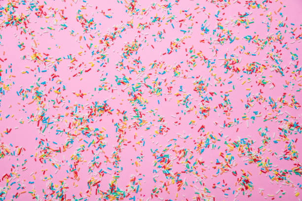 생일 개념입니다. 분홍색 배경에 화려한 뿌리 - sprinkles 뉴스 사진 이미지