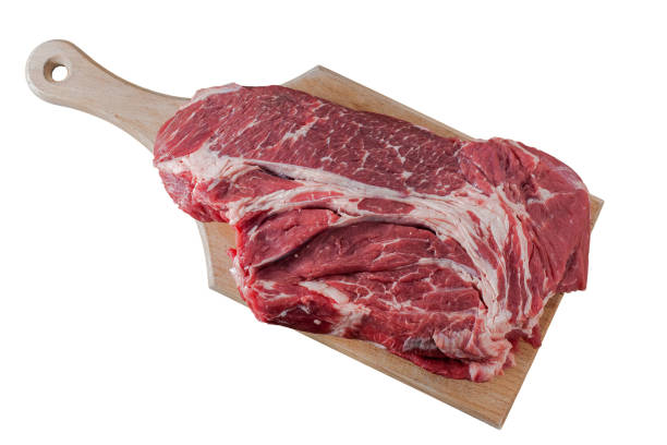 istock Beef meat on cutting board isolated on white background 1138244608