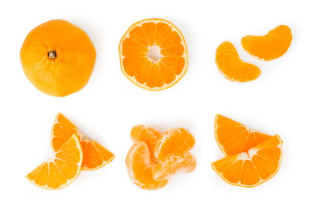 istock Set tangerines, half, slices in a different form on a white. The view from the top. 1138245924