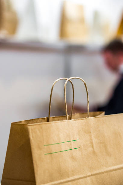 istock disposable bag of kraft paper on a blurred background. 1138248436
