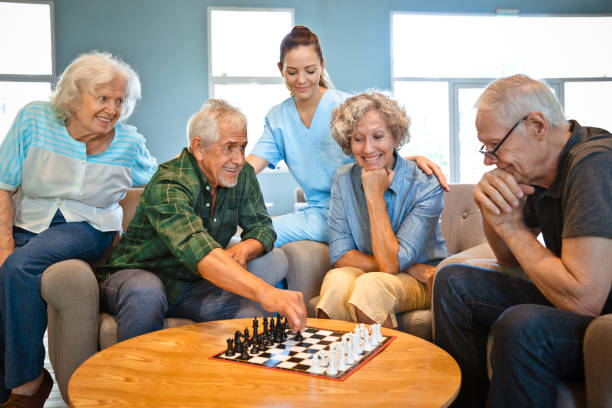 istock Senior men playing chess with friends at home 1138248662
