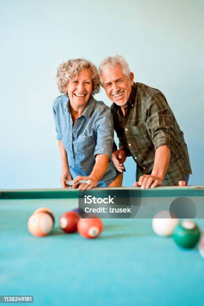 Happy Senior Friends Playing Pool Ball Together Stock Photo - Download Image Now - Pool - Cue Sport, Senior Adult, Friendship