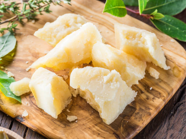 istock Parmesan cheese on wooden cutting board. 1138250280