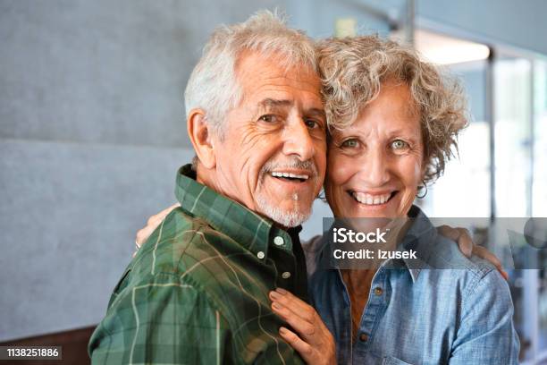 Portrait Of Smiling Senior Couple At Home Stock Photo - Download Image Now - Argentina, Happiness, Retirement Community