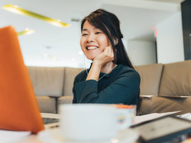 istock Young Asian woman working at alternative work space 1138252104
