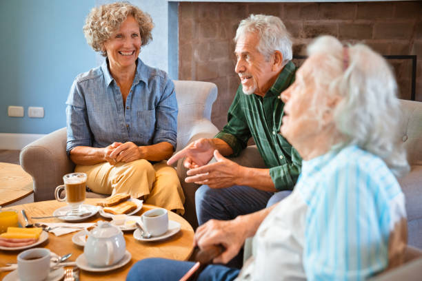 istock Senior friends talking during breakfast at home 1138252288