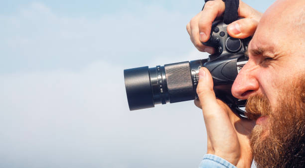istock Photographer Bearded Guy with a Mirror Camera 1138252402