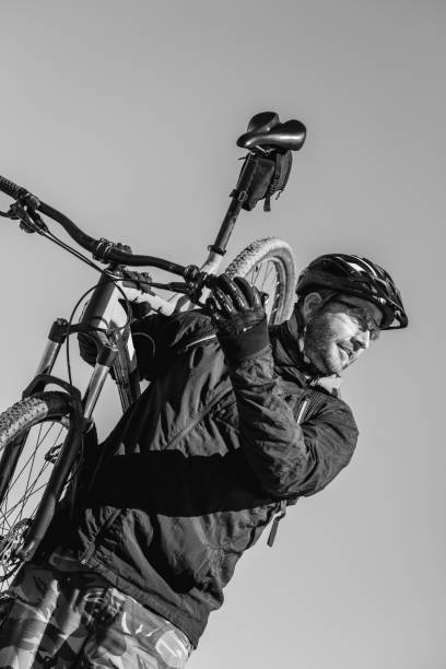 portrait of caucasian man biking - ontario spring bicycle city life imagens e fotografias de stock