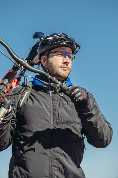 portrait of caucasian man biking - ontario spring bicycle city life imagens e fotografias de stock