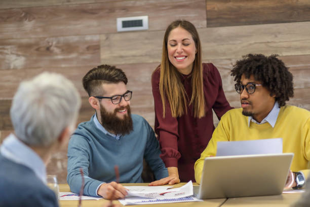 istock Group of multi generation business colleagues in open hub office 1138256052