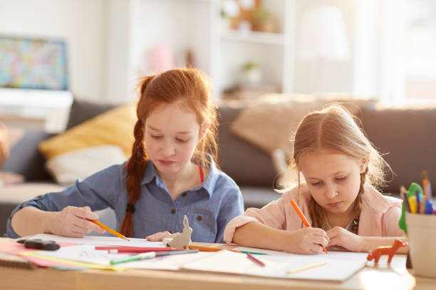 istock Girls Drawing in Sunlight 1138257768
