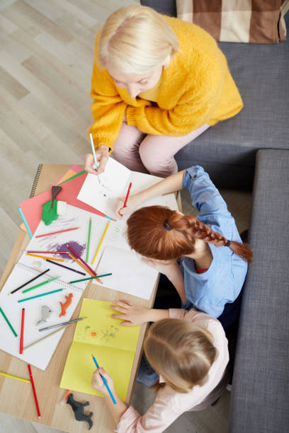 istock Two Girls Making Handmade Cards 1138257802