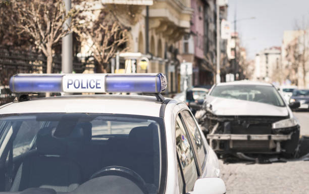 istock Police car arriving at a car crash scene 1138258496