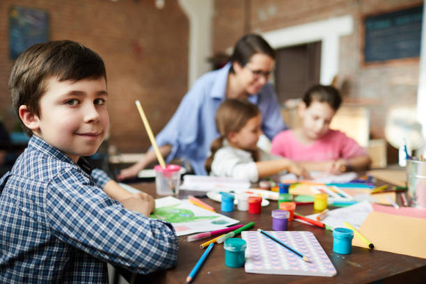 istock Cute Little Boy in Art Class 1138260060