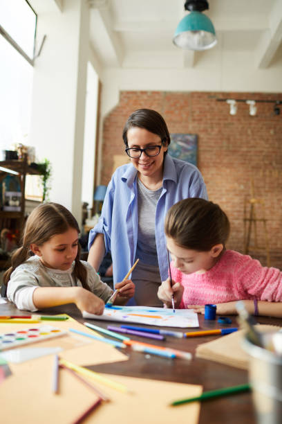 istock Modern Mother with Two Girls 1138260067