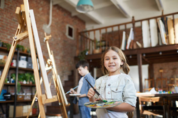 istock Cute Girl Posing in Art Class 1138260113