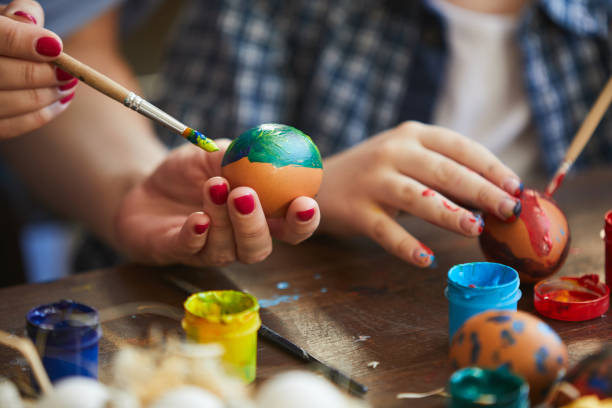 istock Mother and Child Painting Easter Eggs 1138260133