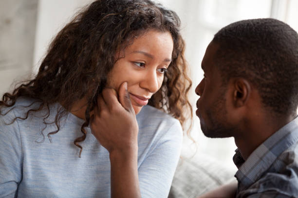 istock Loving black man cheering sad young girlfriend 1138263361