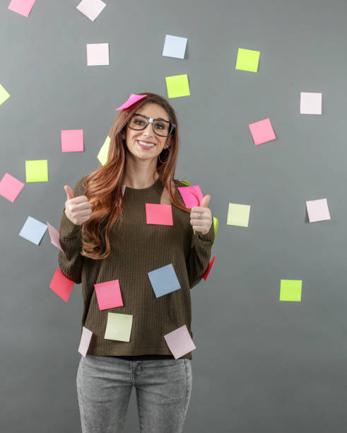 istock Woman with sticky notes posted all over her and background 1138264763
