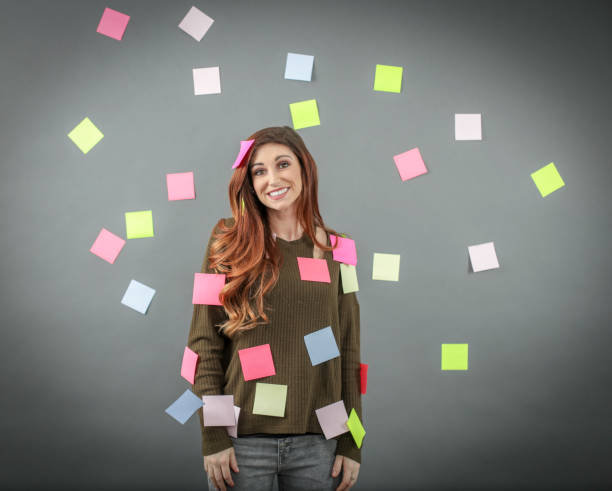 istock Woman with sticky notes posted all over her and background 1138264770