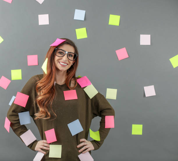istock Woman with sticky notes posted all over her and background 1138264775