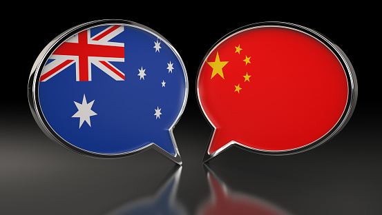 Australia and China flags with Speech Bubbles. 3D Illustration