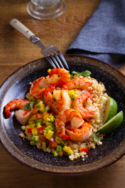 istock Shrimps with cauliflower, mango avocado, red paprika pepper and lime 1138265182