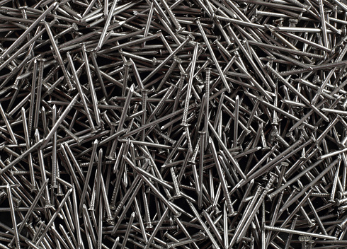 Construction, repair, tools - Abstract metall Pile nails background