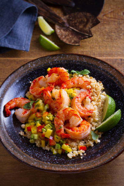 istock Shrimps with cauliflower, mango avocado, red paprika pepper and lime 1138267895