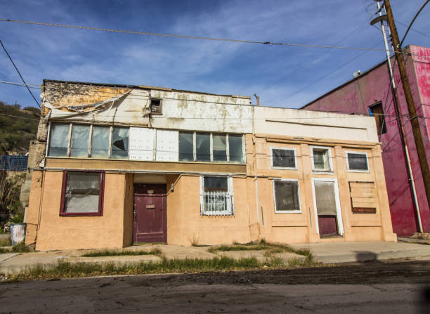 istock Abandoned Commercial Building With Boarded Up Windows 1138267964